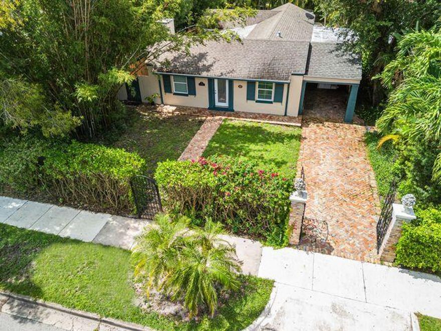 The Robert Cooper House of historic El Cid neighborhood. Designed by architect Cecil A. Henderson and built in 1941. It is considered to be a vernacular masonry home that was placed on the historic register in 1995. A simple but elegant design with a delicate serene feeling. The master bath has art deco floor and wall tiles, 2 walk in closets, and a jacuzzi tub. The dramatic coral stone fireplace is a focal point and the kitchen floor is vintage Miami-Dade County Pine . Red oak, terra cotta, pine and tile floor coverings showcase a unique natural beauty. The pool and spa make you feel like you are at a tropical resort.
but...moments away from Clematis Street, Norton Art Museum, Antique Row, Joseph's Gourmet Market, and Palm Beach Island shopping.  A precious gem of a home awaits you