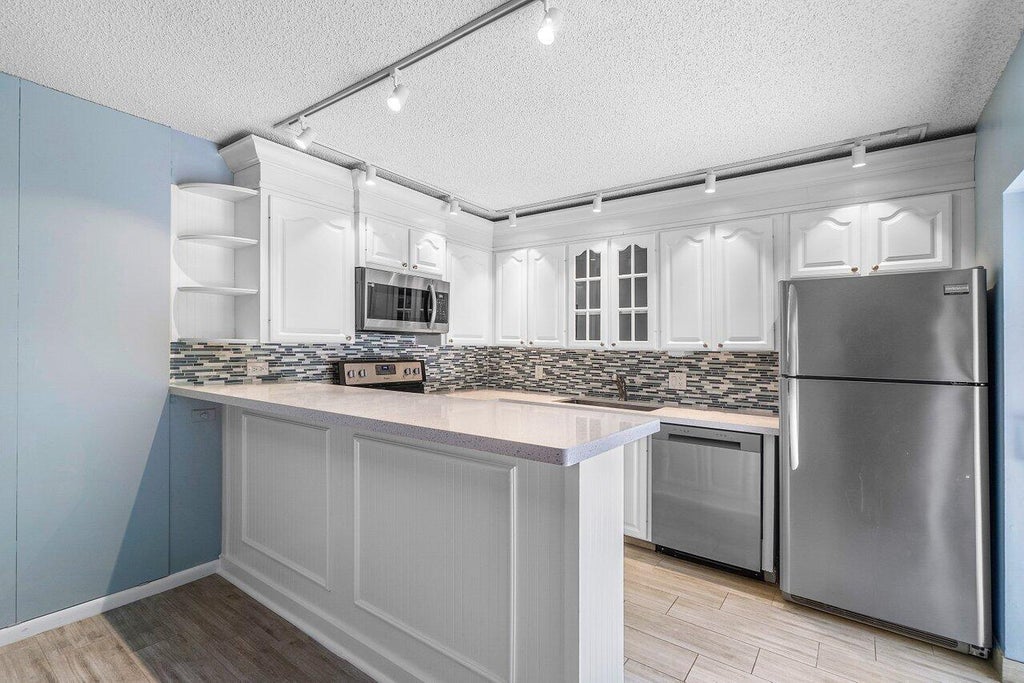 Photo of 1311 13th Terrace, Palm Beach Gardens, FL 33418 (MLS # R11092698)