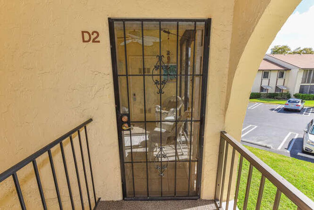 Photo of 305 Knotty Pine Circle #D-2, Greenacres, FL 33463 (MLS # B26000485)