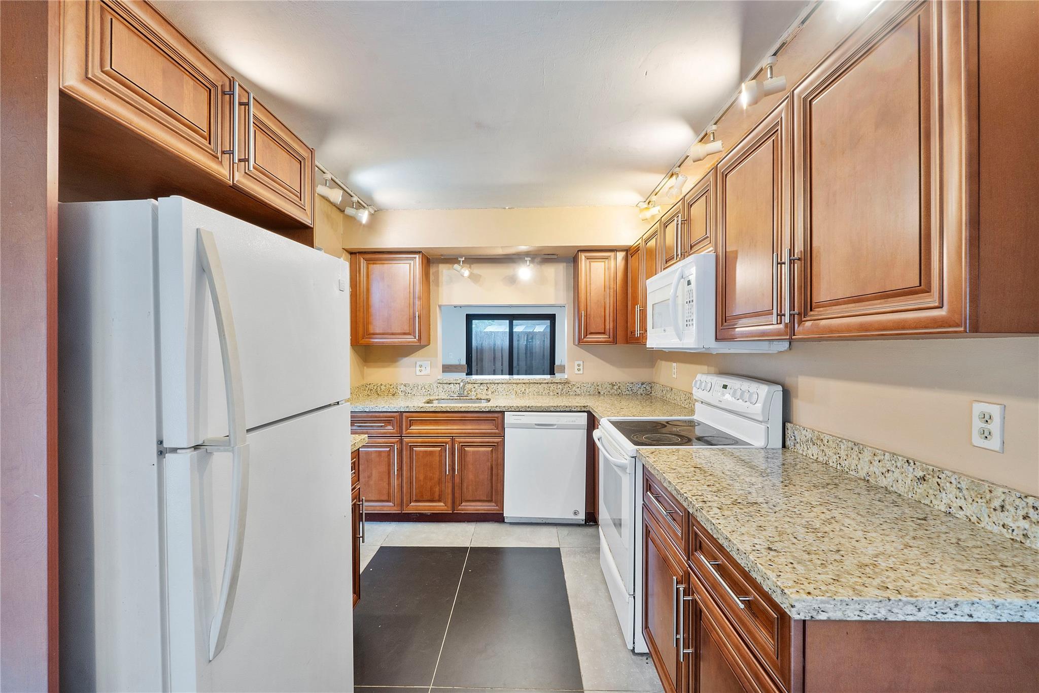 FHA, VA FRIENDLY NO MINIMUM DOWN PAYMENT REQUIRED! SELLER WILLING TO OFFER A CREDIT FOR RATE BUYDOWN OR TOWARDS CLOSING COSTS. INVESTORS CAN RENT RIGHT AWAY! HOA INCLUDES INSURANCE AND ALL EXTERIOR REPAIRS. IMPACT WINDOWS AND DOORS. NEW WOOD FLOORING UPSTAIRS, NEW INTERIOR PAINT & NEW OVEN! 3 Bedroom 2.5-bathroom townhome in family friendly Centura Parc. The kitchen features granite countertops & real wood cabinets. Tile throughout the first floor & new wood flooring upstairs. Large primary bedroom features walk-in closet. Screened front patio & fenced rear patio perfect for grill & outdoor furniture. Gated community features an Olympic-sized pool, tennis & basketball courts, RV & boat storage, fitness center, 24/7 security & a private school onsite. Community offers many family activities