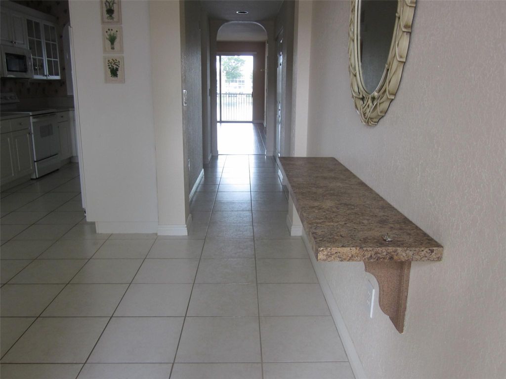 Photo of 7739 Southampton Ter #215, Tamarac, FL 33321 (MLS # F10416717)