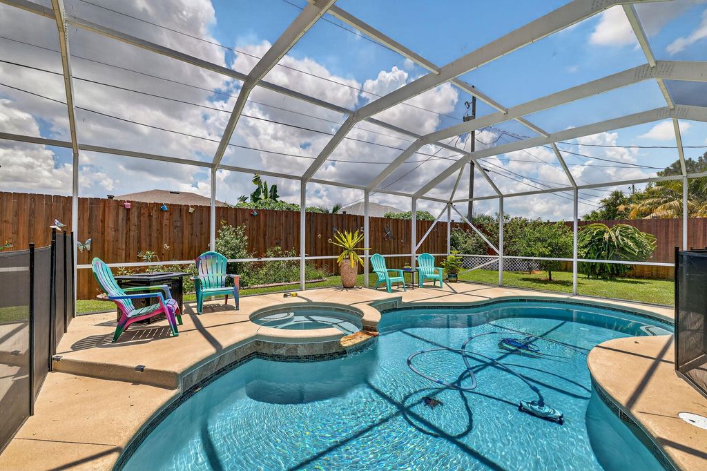 Photo of 3949 SW Helmlinger Street, Port Saint Lucie, FL 34953 (MLS # R11111202)