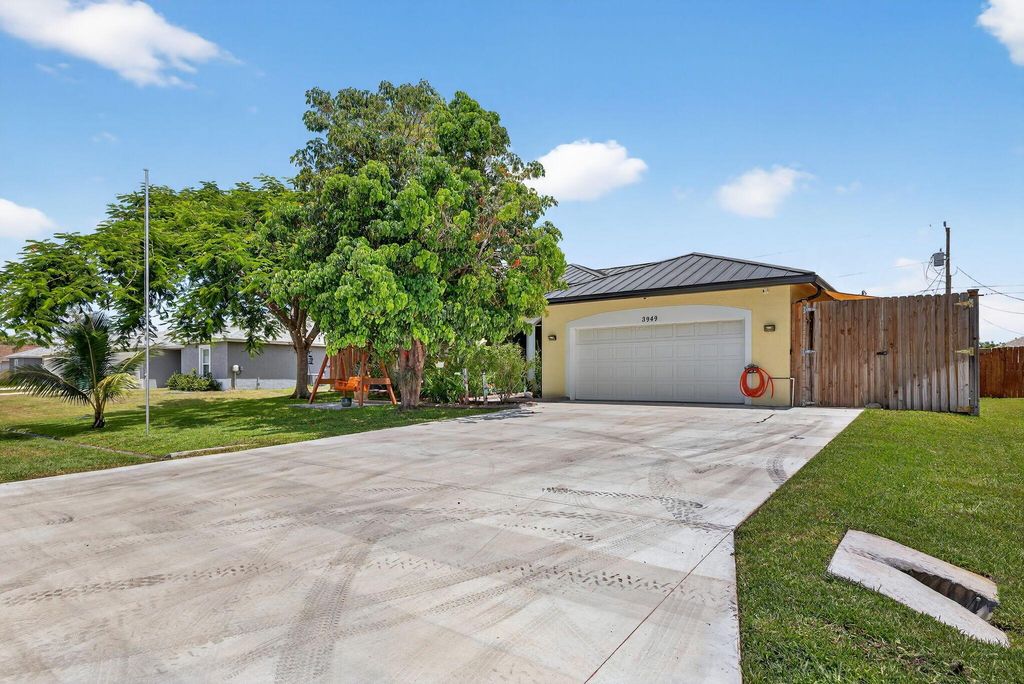 Photo of 3949 SW Helmlinger Street, Port Saint Lucie, FL 34953 (MLS # R11111202)