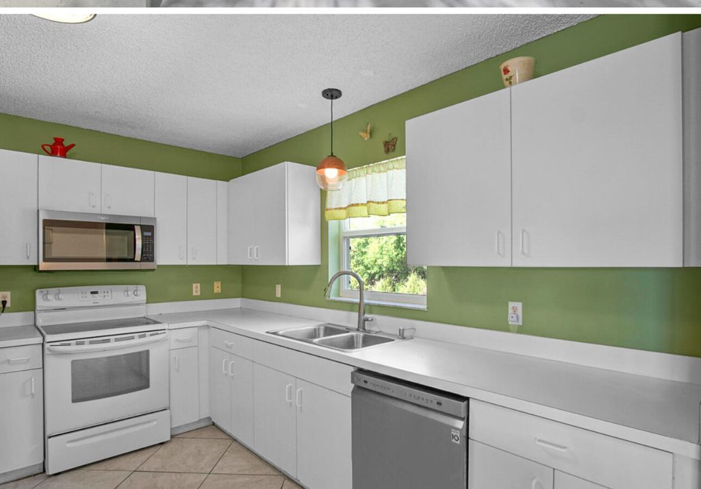 Photo of 5680 Travelers Way, Fort Pierce, FL 34982 (MLS # R11161423)