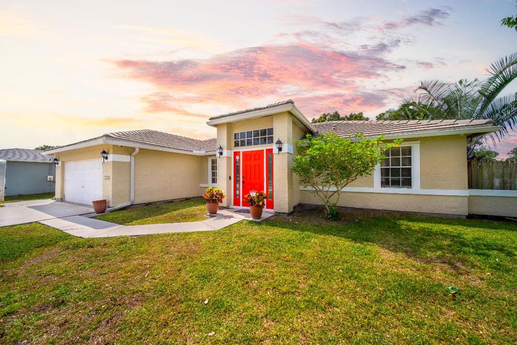 Photo of 1652 SW Bellevue Avenue, Port Saint Lucie, FL 34953 (MLS # R10978173)