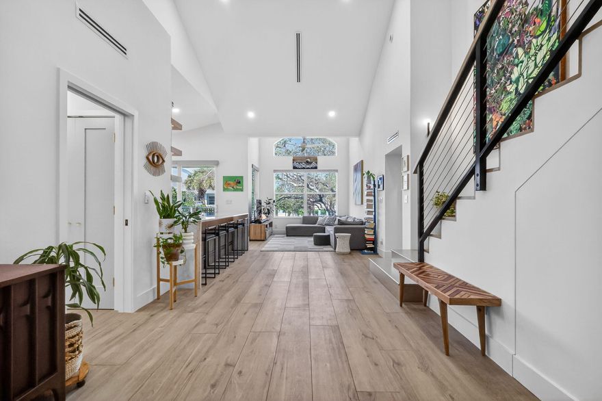 Completely updated and customized unit in Sea Colony. All renovations completed in 2024.  4 bedroom, 3 full bath. New plumbing throughout. New electrical throughout, replaced panel and added surge protector, ran new wiring throughout, recessed lighting in all rooms, all Lutron switches and outlets. Master bath with spacious 5 x 7 shower including 2 separate shower heads, rain head, and handheld. Toto bidet toilet, custom floating double vanity, custom built in linen cabinet. Fully renovated guest bathrooms with Kohler fictures. Custom wood staircase with custom steel railing and tension cables
Custom dinette bench in kitchen with storage. Custom fluted vent hood. Custom Fluted island backsplash. Long wood plank flooring and Italian ceramic tile. Custom kitchen with European style cabinets Full renovation completed early 2024. Improvements/renovations included below:

 
Custom kitchen with European style cabinets, quart countertops with waterfall edge and integrated backsplash
Custom wet bar under stairs 
All new appliances: Miele fridge, GE profile dishwasher and induction stove, GE microwave, GE washer and dryer 
Enclosed loft
Schlage keypad and door hardware
New garage door seal and My Q opener
New 50 gallon water heater with Watts hot water recirculating system - 2024
Overlooking pool and partial lake view
New roof 2025  
Impact Windows and slider 2016
HVAC 2016 - serviced twice yearly (last service 02/2026) - Resealed duct with 2024
Benjamin Moore Paint 
Custom Closet Built-ins

All work was permitted and inspected. 

Permits: Jupiter Building Dept
Windows (2016) : 16-002235-BLDR
A/C (2016) : 16-009472-AC
Electrical Sub (2023) : 23-073778-ELEC-R
Roof (2024) : 24-077818-ROOF-C
Interior (2024) : 23-072303-COMM
Plumbing Sub : (2023) 23-073753-PLUMC
Electric rewire (2024) : 23-073816-ELEC-C
Plumbing re-route (2025) : 25-085159-PLUMC
Garage (2018) : 17-010750-BLDR