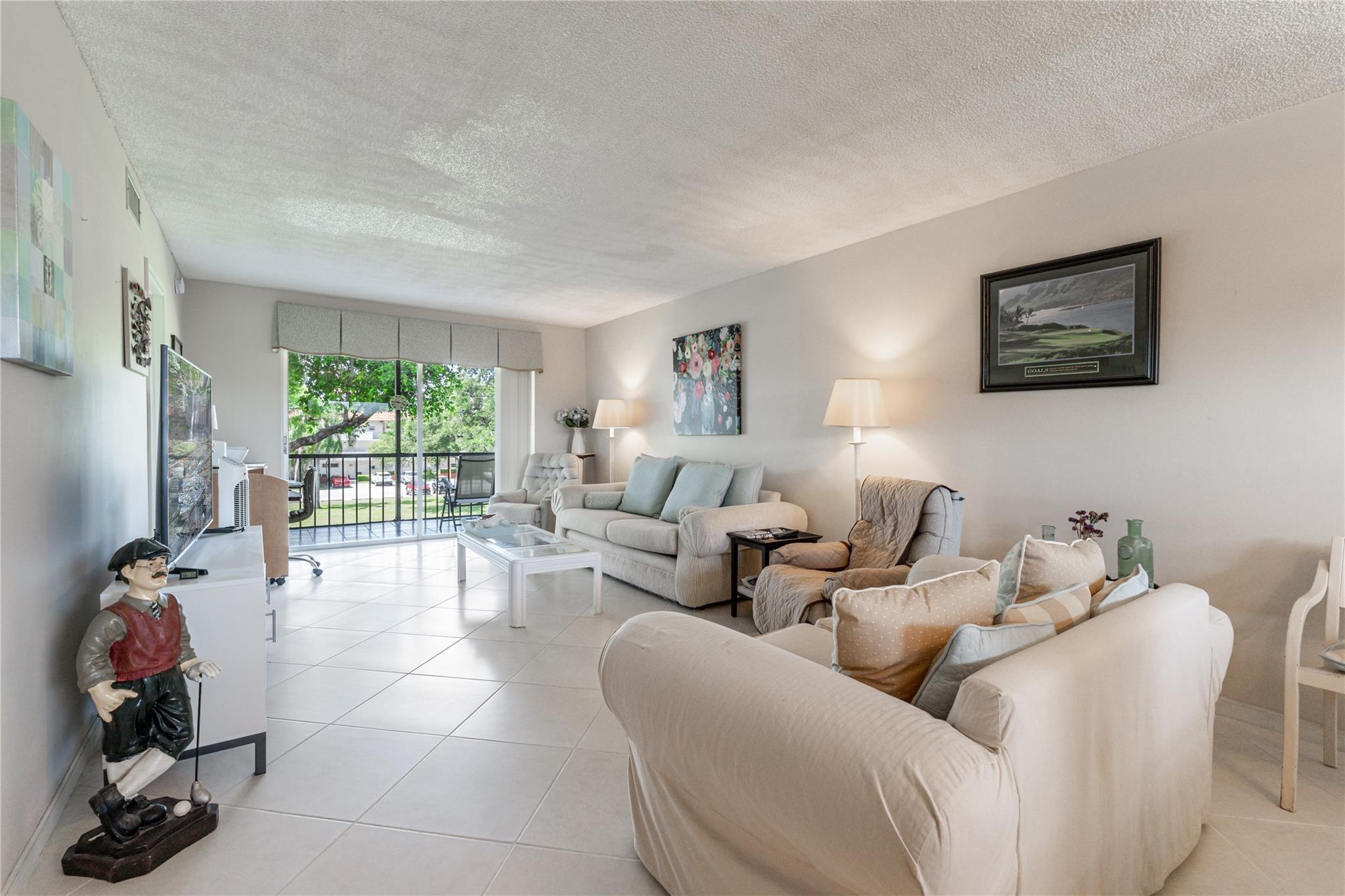 HUGE PRICE REDUCTION TO SELL FAST! WALK TO CLUBHOUSE! 3rd Floor, Corner, 1BR/1.5BA. PAR 3 GOLF 6TH GREEN VIEW. IMPACT GLASS. Accordion Shutters. NEW AC! TOTAL Appliance Service Contract. 18" Tile on a diagonal throughout living areas. FULLY FURNISHED! Recreation Lease PAID IN FULL! FREE golf (except cart fees) on two 18 hole courses (PGA & Par3); Amenities include Restaurant, Billiard Room, Bbq/Picnic Area, Clubhouse, Courtesy Bus, Exercise Room, Heated Pool, Library, Putting Green, Sauna, Shuffleboard, Tennis, Pickle Ball, Vehicle Wash Area, Electric Car Charging Station. Close to shopping, dining & highways. 15 min. to the beach. Association says 55+ age required; YOU'LL CLEAN AND READY! MOVE RIGHT IN!