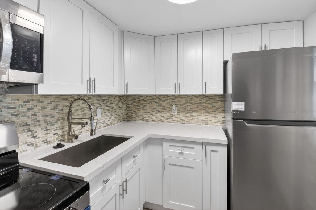 Photo of 2213 NE 1st Court #204, Boynton Beach, FL 33435 (MLS # R11153486)