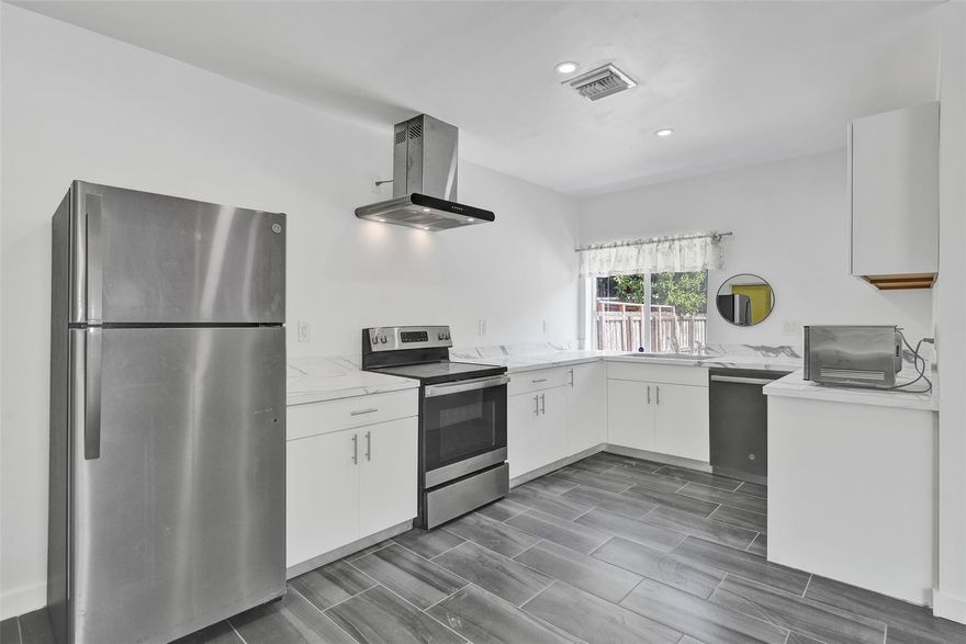 Bright, newly renovated 2-bed, 1-bath home plus versatile den in a central location — just off Federal Highway and minutes from the ocean. This updated interior features modern finishes, an open living/dining flow, contemporary kitchen with new appliances and countertops, stylish bath, and fresh flooring and paint throughout. Ideal for first-time buyers, downsizers, or investors seeking turnkey convenience in a walkable, coastal corridor. Easy access to shops, dining, transit and beaches. Schedule a showing today — contact for details and private tours.