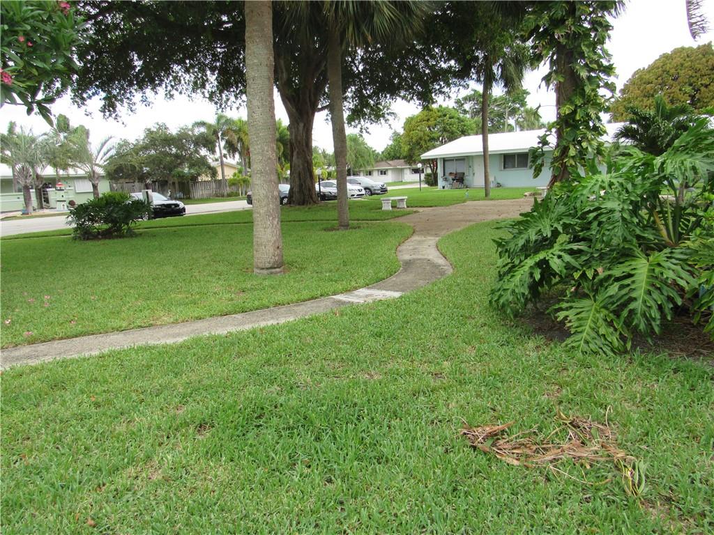 This is the nicest, most improved one bedroom in the complex. No carpet; all ceramic tile floors, No tub to get in and out of but a beautiful shower with easy access. New paint and baseboard in 2021. Bath has been updated, kitchen has newer cabinets, appliances and granite counters. Also impact windows and central air conditioning.
Rear door replaced with impact in 2020. There's storage and laundry on premises and the park-like grounds are beautiful and peaceful. Tenant occupied until mid September. Don't let this one get away. No car needed. Walk to Publix, shops, library and transportation.