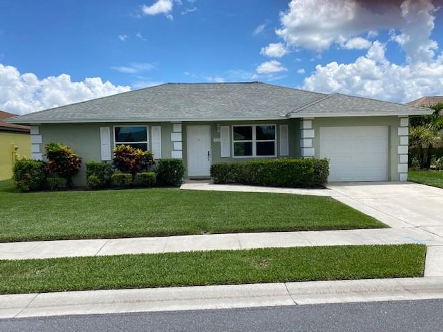 Paradise in your backyard!  This 2 bedroom, 2 bath, 1 car garage lakeview home is in the heart of Jupiter!  This CBS constructed home is located in the quiet neighborhood of Indian Creek, close to beaches and shopping.  The home has been updated with all new impact windows, new A/C system, new wood plank tile floors throughout, new kitchen and appliances with quartz countertops, new closet systems, new lighting, updated bathrooms with new washer/dryer.  The home features vaulted ceilings with an open floor plan and spacious bedrooms with walk-in closets.  This home is next to a community park with playground and walking trails.  Community pool and tennis membership is available.  All measurements are approximate.