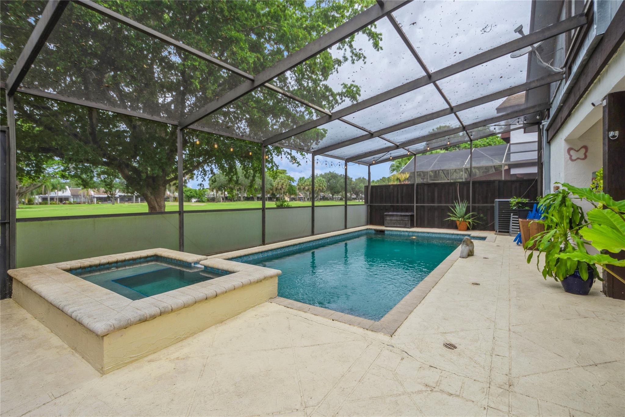 Golfer’s Green! Enjoy lush greenery and golf view of the 17th hole from your screened patio and heated, saltwater pool. 3-bedroom, 2-1/2 bath, single family, 2-story home. New roof in June 2025! Impact glass windows and doors. 2024 air conditioner. 2024 washer and dryer. Spacious, updated kitchen with butcher block counters, stainless steel appliances, pullouts, and lots of storage. Soaring, cedar beam ceiling adds rustic charm to make a dramatic living room space. A downstairs bonus room can be an office, den, or guest room. All bedrooms and the laundry are upstairs. The Pembroke Lakes Golf & Racquet Club is a stone’s throw away. 2 parking spaces in front of the property plus guest parking. A job relocation forces the sale of this beautiful, well-loved home.