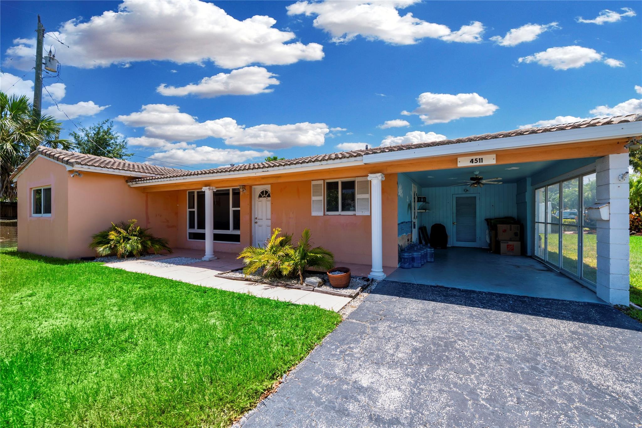 This charming 2-bedroom, 2-bathroom single-family home is just a short walk to the beach! Situated on a desirable corner lot, it offers a fenced backyard perfect for small pets or outdoor entertaining, plus a carport for convenient parking. Inside, you’ll find an updated kitchen with sleek white modern cabinets, stainless steel appliances, and tile flooring throughout. Enjoy volume ceilings with exposed beams that create an open, airy feel, and relax in the spacious screened-in patio—ideal for indoor-outdoor living. Don’t miss this opportunity to enjoy coastal living at its best!
