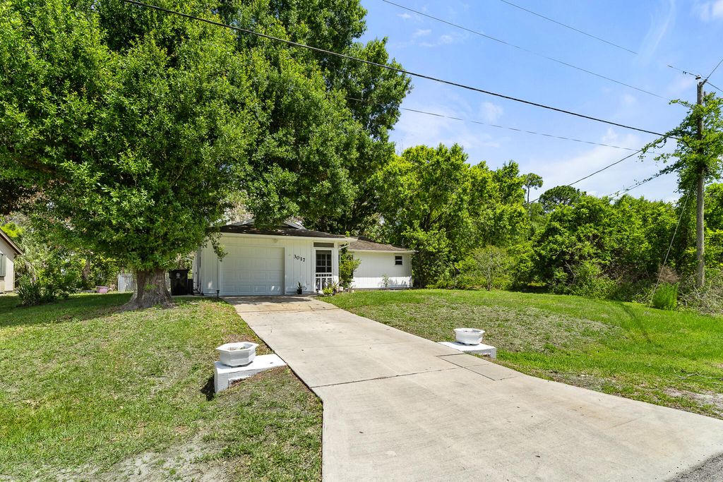 Photo of 3017 SW Collings Drive, Port Saint Lucie, FL 34953 (MLS # B26016507)