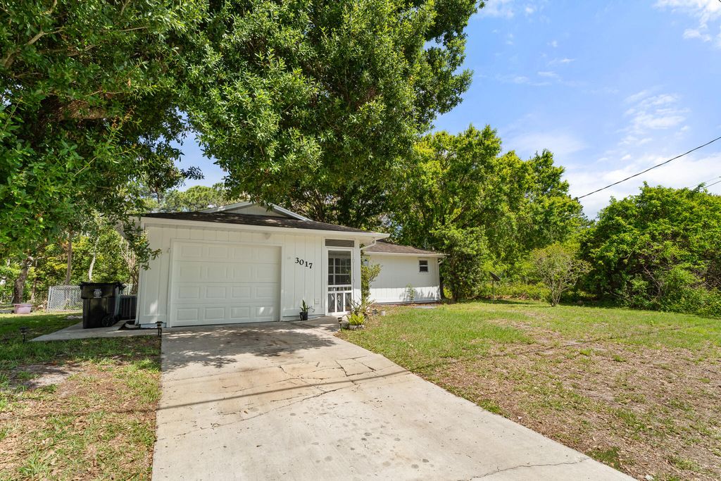 Photo of 3017 SW Collings Drive, Port Saint Lucie, FL 34953 (MLS # B26016507)