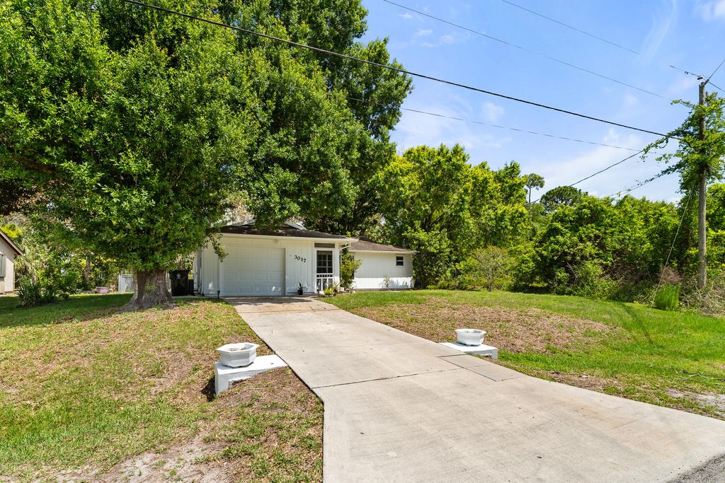 Photo of 3017 SW Collings Drive, Port Saint Lucie, FL 34953 (MLS # B26016507)