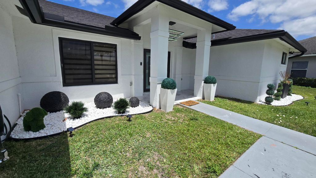 Photo of 113 Waterview Way, Royal Palm Beach, FL 33411 (MLS # B26015476)