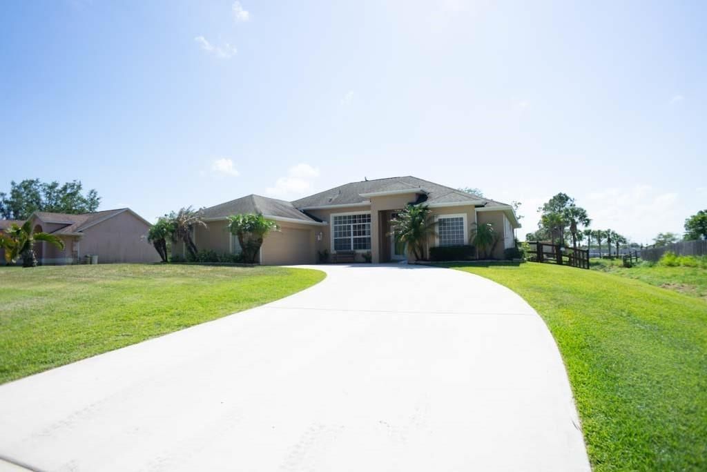 Photo of 109 Sandalwood Drive Dr, Fort Pierce, FL 34947 (MLS # R10709410)