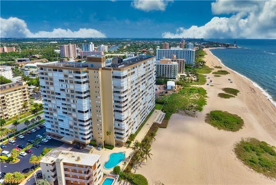 Amazing direct ocean views from this corner unit with a wrap around balcony.  Completely updated kitchen and baths and a split floor plan make this unit a must see.  Spacious, eat in kitchen with light cabinetry, white appliances and granite counters.  Hurricane impact windows and slider.  Building sits on the sand with 24/7 concierge security, fitness center, new water towers installed one year ago, pool, BBQ grills and shuffleboard.   Active community where one owner is 55 years plus.  Extra stoarge and plenty of closet space.