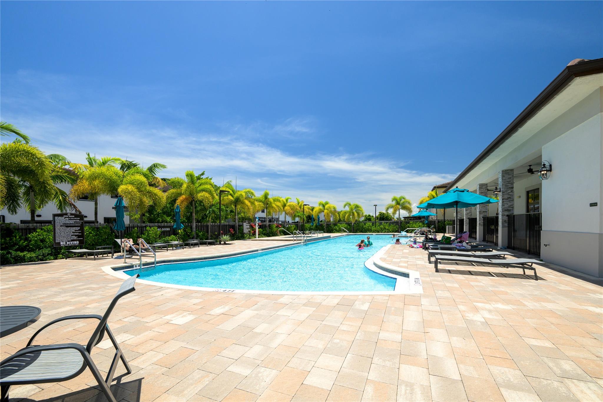 Experience the best of South Florida living where convenience, comfort, and outdoor enjoyment meet. This modern home offers peace of mind with newer construction, energy-efficient design, and low-maintenance living. Step outside to your private backyard retreat with covered patio and fruit trees—ideal for relaxing or entertaining. The surrounding area offers access to nature, shopping, dining, and recreation that make everyday life feel like a vacation. Inside the community, enjoy resort-style amenities like a pool, gym, clubhouse, and playground. Whether you're seeking a primary residence, second home, or long-term investment, this move-in-ready property delivers the lifestyle and flexibility you need. With all Impact windows for peace of mind & electric car charger inside the garage.