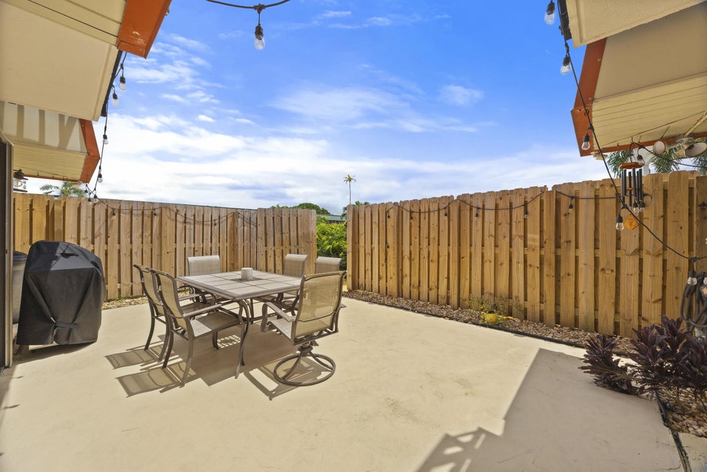 Photo of 3157 Gardens East Drive #D, Palm Beach Gardens, FL 33410 (MLS # R11015058)