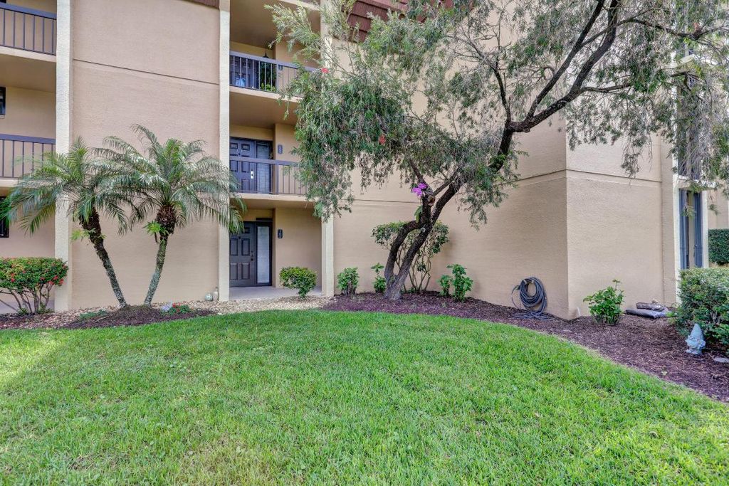 Photo of 5390 Woodland Lakes Drive #102, Palm Beach Gardens, FL 33418 (MLS # R11147621)