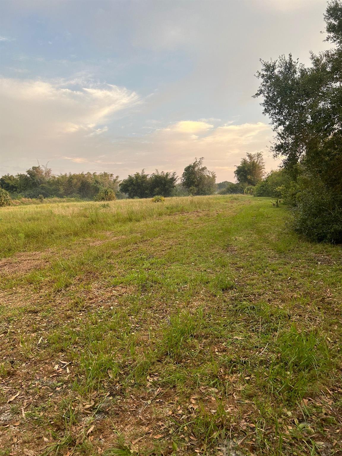 East Okeechobee location! 5.14 acres, bring the horses and cows and build your dream home! located in Spot in the Sun. Partially fenced. Adjacent 5 acres also available. 20 miles from the east coast. Seller asks to be accompanied by a realtor or listing agent for showings.