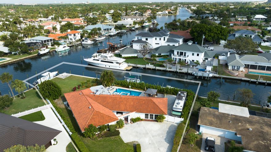 This is your opportunity to own one, of only 11 waterfront point lots, in The Village of North Palm beach with no fixed bridges. This property has 240 feet of water frontage. Lot measures 52 x 173 x 49 x 190 x 110 (.43 acres) .New seawall and cap. Newly renovated pool and spa. 27,000lb boat lift, floating jet ski dock, gas firepit. On a cul-de-sac.  Opportunity to build your custom dream house. 5 miles from Palm Beach Inlet. Minutes to the new North Palm Beach Country Club featuring the newly redesigned Jack Nicklaus Signature golf course, pool, tennis, and fine dining. Close to beaches, recreation, restaurants and entertainment. Convenient to major highways and Palm Beach International Airport.