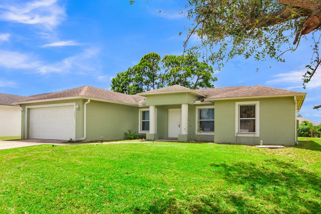 Photo of 1002 SW ROMAINE Lane, Port Saint Lucie, FL 34953 (MLS # B26070196)