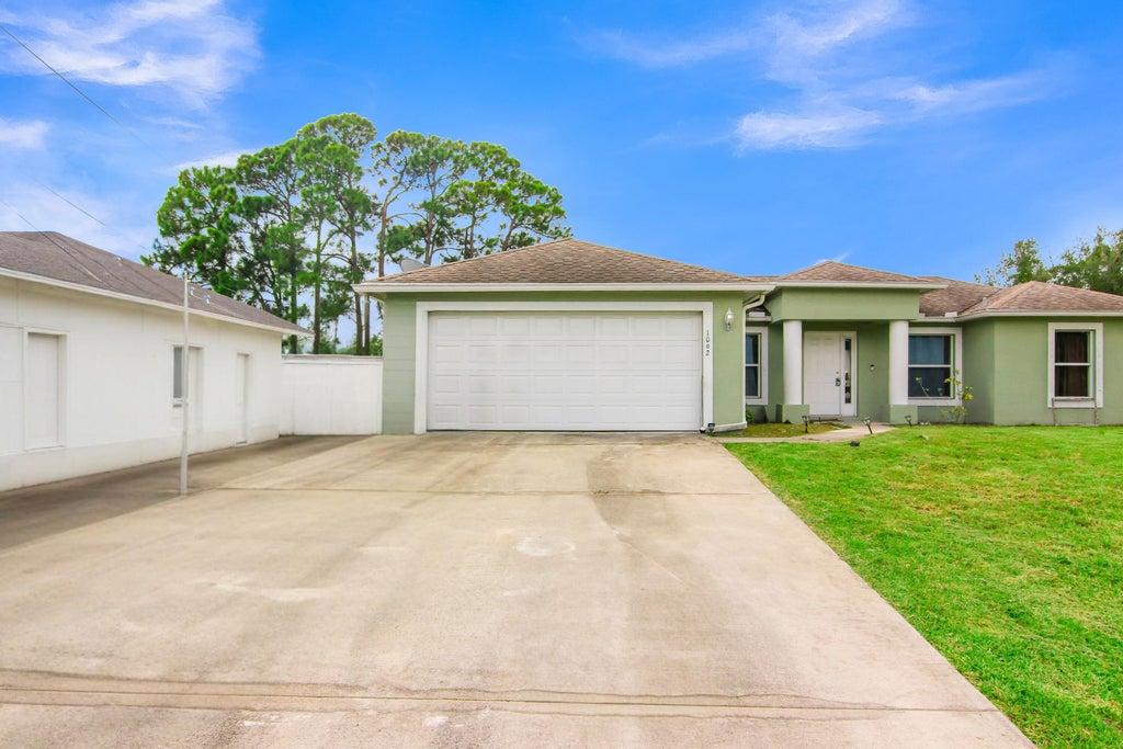 Photo of 1002 SW ROMAINE Lane, Port Saint Lucie, FL 34953 (MLS # B26070196)