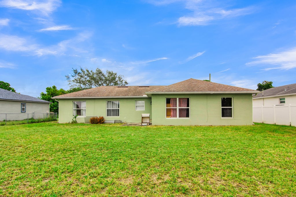 Photo of 1002 SW ROMAINE Lane, Port Saint Lucie, FL 34953 (MLS # B26070196)
