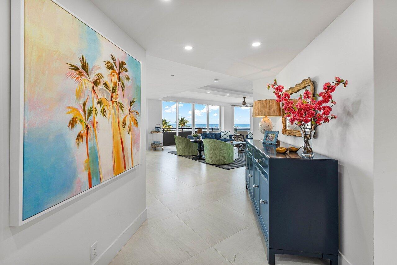 Your 2 pets are welcome at this newly Renovated Direct Oceanfront wraparound 2 Bedroom - 2.5 Bath corner residence in the exclusive Palm Beach Hampton. This light bright and airy contemporary home offers a coastal feel with open spaces & forever ocean views. Every room is beautifully detailed with porcelain tile, custom lighting & built-ins. The oceanfront master suite features floor to ceiling glass, custom closets, a stunning bath with dual sinks, marble shower & soaking tub. The guest suite has 4 custom bunk-beds that can accommodate all your children & grandchildren. The newly designed kitchen is an epicure's delight with Wolf & Subzero appliances and island seating for 6. There is a beautifully designed workplace with custom built-ins and separate powder room with elegant cabinetry &
