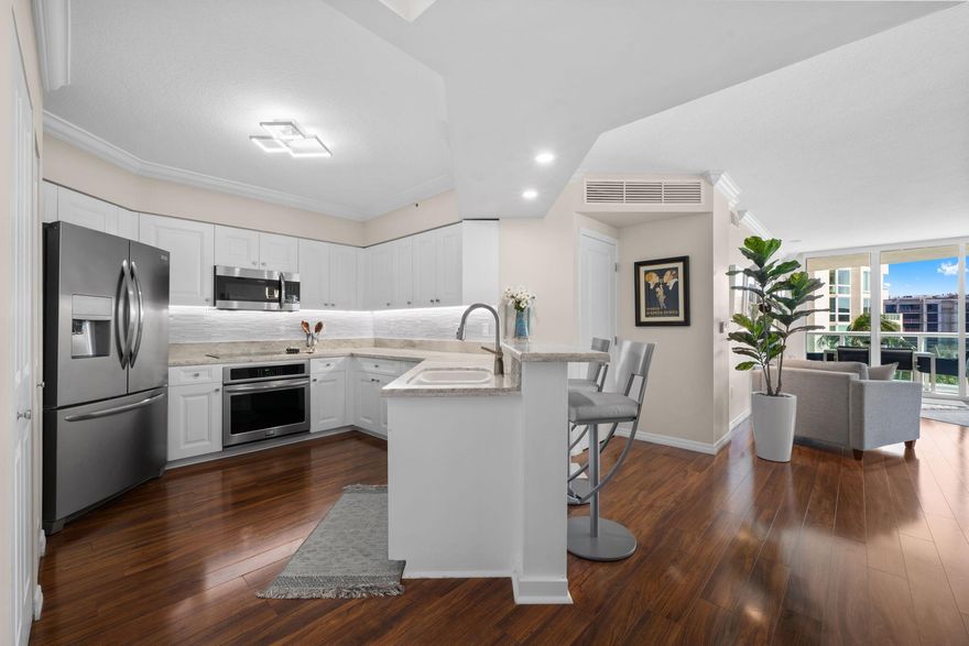 Welcome to Tropical South Florida! Sunshine, Water Views & Convenient Las Olas Living! Beautifully Renovated, Mint Condition & Move in Ready! Open Floor Plan w/ East Exposure, Soaked in Natural Light w/ Floor to Ceiling Glass throughout, All w/ an Expansive Balcony Providing the Perfect Outdoor Entertaining Space. This Split bedroom floorplan allows for a double master configuration, each w/ ensuite bath, custom closets & walls of windows overlooking palm trees & the river. Upgraded kitchen & baths w/ beautiful white quartz & SS appliances, wood & tile flooring, motorized window treatments & more! Resort style amenities: concierge, heated pool, spa, cabanas, theater, bus. center, state of the art gym, valet parking, board room, & 24 hour security. Las Olas: The Neighborhood Everyone Wants! Assigned Secure Covered Garage Parking, Water, Sewer and Trash Included! Full Service Building Offering an Active Lifestyle with Social Activities for All Ages. Watergarden is a Wonderful place to call Home!