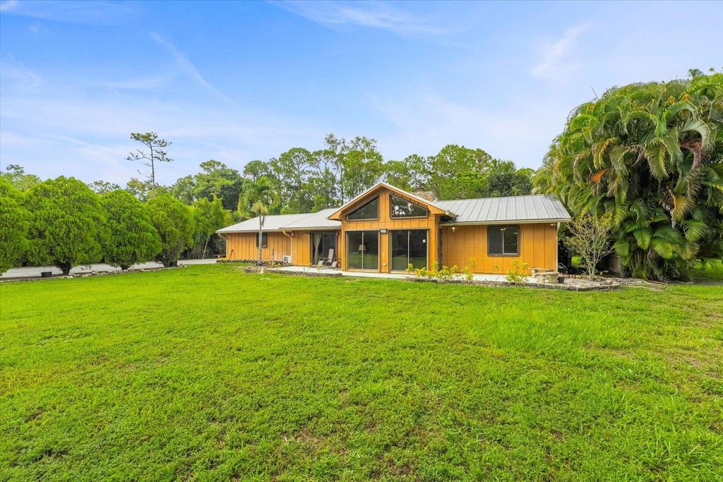 Photo of 13573 49th Street N, The Acreage, FL 33411 (MLS # R10999713)