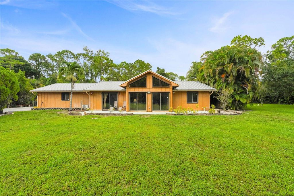 Photo of 13573 49th Street N, The Acreage, FL 33411 (MLS # R10999713)