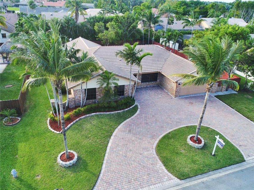 Welcome to the finest, prestigious, rarely available Glen Isle. This home features very open floor plan with updated kitchen and baths. Freshly painted, roof replaced in 2004,runs on two A/C units, new sprinklers pump (August 2017) beautiful tiled floors throughout, including garage. This home seats on an over sized lot with HUGE fully fenced backyard, large patio, outdoor kitchen, pool and the shed attached to the house. Highly desirable area in Coral Springs with A+ schools, no HOA