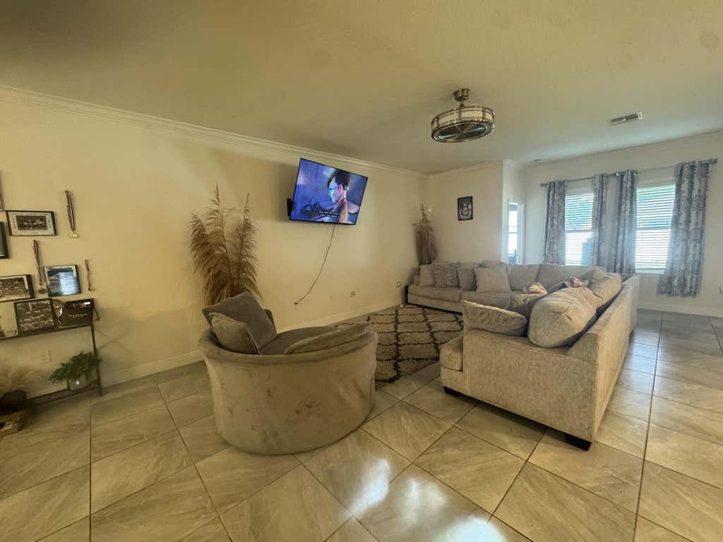 Photo of 4026 SW Mccandless Street, Port Saint Lucie, FL 34953 (MLS # B26048471)