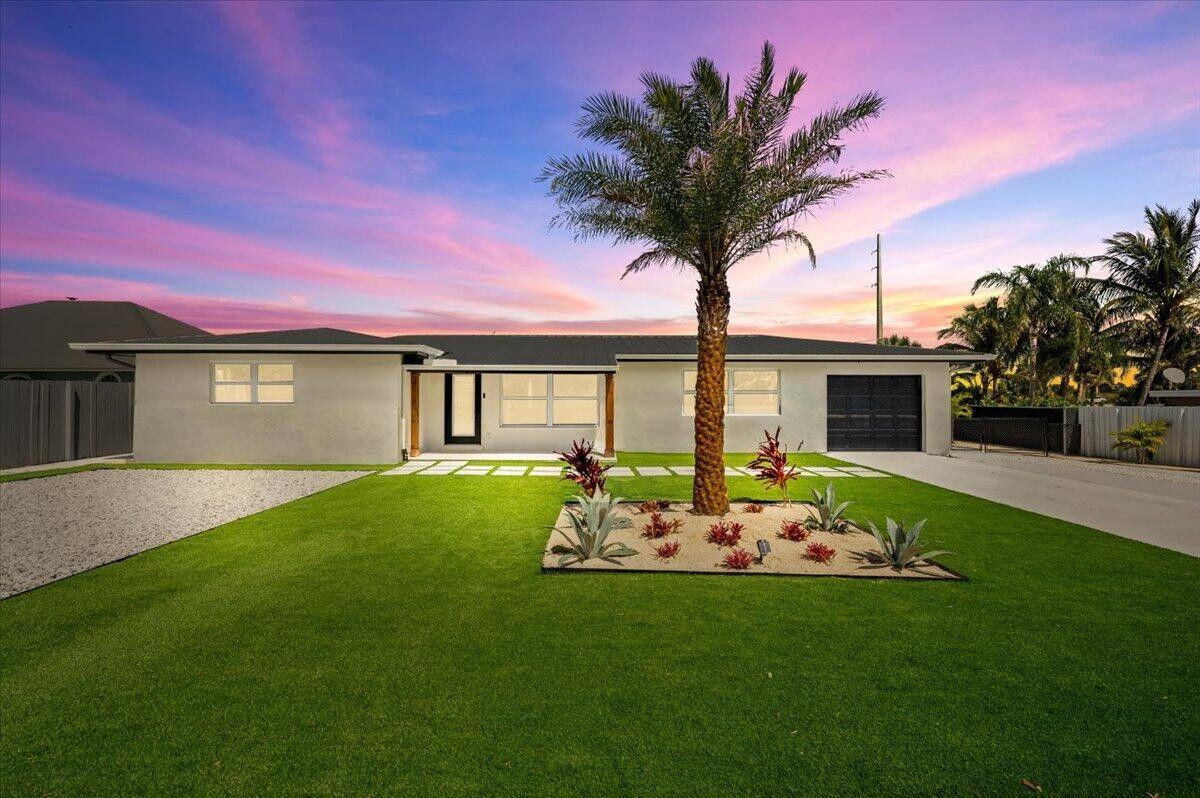Experience unparalleled luxury in this breathtaking 3-bedroom, 2-bathroom single family home! Unwind in a modern paradise meticulously crafted with top-quality finishes and exceptional attention to detail. Gleaming quartz countertops with waterfall accents, brand new smart Samsung appliances, and gorgeous porcelain tile floors create a space that's both beautiful and functional. Relax in spa-like bathrooms featuring floor-to-ceiling porcelain tile and oversized walk-in showers. Fully Furnished turn key, Just bring your wardrobe and tooth brush, as this home sets beautifully staged. Outside is pristine landscaping in the front yard, the backyard it is all Turf with a mini putt-putt green for pleasure. Enjoy a covered back patio for all your BBQ and outdoor dining experiences.