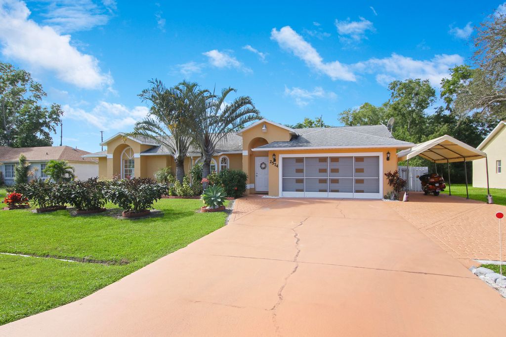 Photo of 2574 SE Rock Springs Drive, Port Saint Lucie, FL 34952 (MLS # R10771482)
