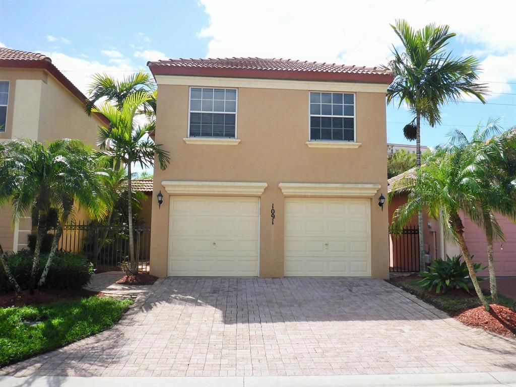 Photo of 1091 Via Jardin, Riviera Beach, FL 33418 (MLS # R10698811)