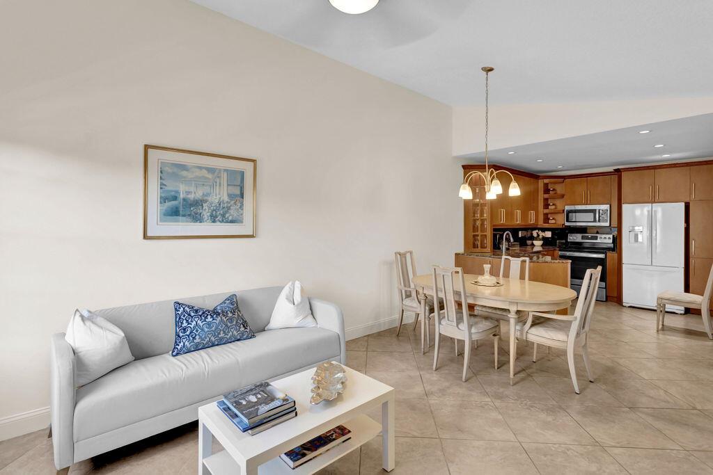 Welcome to your haven at Waterside Village! This well-lit and airy second-floor unit is now available for a six-month rental. It offers two spacious bedrooms with ample closet space and abundant natural light. Additionally, you'll discover two recently updated bathrooms and a chef's dream kitchen. This culinary space is complete with custom wood cabinets, elegant granite countertops, and brand-new stainless steel appliances, seamlessly flowing into the roomy living area. The condo boasts tile flooring throughout, ensuring a carpet-free living environment. Practical amenities such as a washer/dryer, accordion shutters, and first-floor storage space are at your disposal. Step out onto the covered private patio, perfect for enjoying cocktails or your morning coffee.