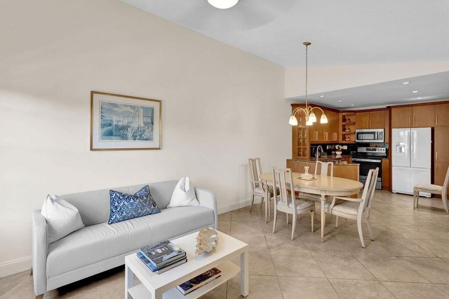 Welcome to your haven at Waterside Village! This well-lit and airy second-floor unit is now available for a six-month rental. It offers two spacious bedrooms with ample closet space and abundant natural light. Additionally, you'll discover two recently updated bathrooms and a chef's dream kitchen. This culinary space is complete with custom wood cabinets, elegant granite countertops, and brand-new stainless steel appliances, seamlessly flowing into the roomy living area. The condo boasts tile flooring throughout, ensuring a carpet-free living environment. Practical amenities such as a washer/dryer, accordion shutters, and first-floor storage space are at your disposal. Step out onto the covered private patio, perfect for enjoying cocktails or your morning coffee.