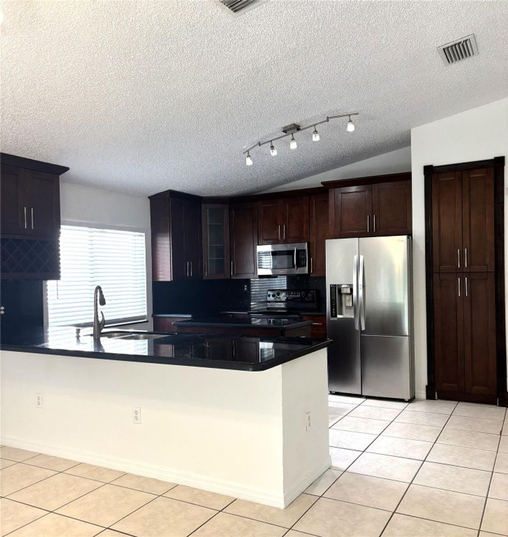 Photo of 10400 SW 24th Court, Miramar, FL 33025 (MLS # F10528376)