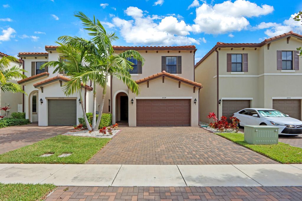 Photo of 6024 Pine Tree Way, Riviera Beach, FL 33410 (MLS # R10795707)