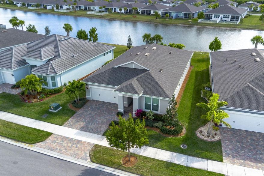 Why wait to build when you can move right in and start enjoying the Florida lifestyle?
This 2023 Pulte CBS construction home offers 1943 sq. ft. under air, this thoughtfully designed home features 2 spacious bedrooms, 2 full baths, and a versatile den with French doors—perfect for a home office, guest space, or potential third bedroom. The open-concept layout is ideal for entertaining, with tile flooring throughout (no carpet) and an expanded great room that flows seamlessly to the south-facing screened lanai overlooking the lake, complete with fine mesh screens to keep out no-see-ums. The gourmet kitchen features granite countertops, a large center island, 42'' cabinetry, soft-close drawers and cabinets, pull-out shelving, a walk-in pantry and upgraded lighting. Additional upgrades include impact windows and doors, a tankless gas water heater, gas dryer, and gas range. The laundry room is equipped with built-in cabinetry and a utility sink for added convenience.
The owner's suite offers tranquil lake views, a spacious walk-in shower, and a well-appointed ensuite bath, this home has been meticulously maintained and offers peace of mind with full hurricane-impact protection throughout.
Located in the sought-after Del Webb at Tradition, residents enjoy unmatched resort-style amenities including two clubhouses, state-of-the-art fitness centers, movement studios, locker rooms, resort and lap pools, pickleball, tennis and bocce courts, walking and lake trails, social halls, catering kitchens, card and craft rooms, lounges, firepits, and a full-time Lifestyle Director. A dog park is coming soon. Ideally situated near Tradition Square, shopping, dining, and Cleveland Clinic, this home delivers luxury, lifestyle, and location without the wait.
Schedule your private showing today and experience resort-style living at its finest.