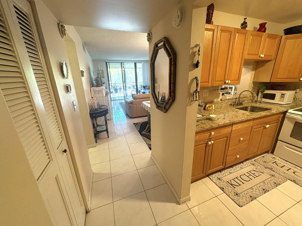Photo of 8150 W Mcnab Road #222, Tamarac, FL 33321 (MLS # B26041764)
