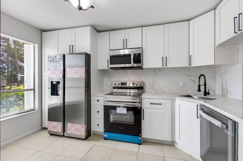 Photo of 799 HILL Drive #C, West Palm Beach, FL 33415 (MLS # B26068918)