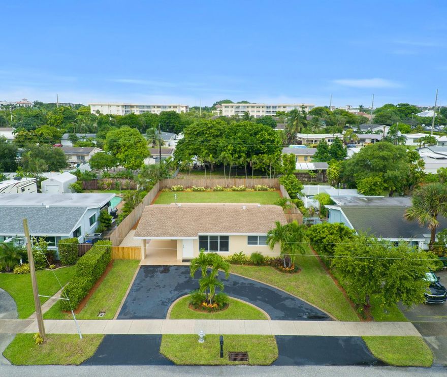 Welcome to this charming East Boca Raton gem which has been completely renovated inside and out! Exceptional Location! 2 Bedroom 1 Bath single family home, bathed in natural light & blanketed with Luxury Vinyl Plank flooring throughout! Plus you're in an A+ School District making this home ideal for families or investors alike. Bonus: NO HOA! In the heart of Boca Raton, you'll appreciate being within walking distance to downtown Boca & only 1.5 miles from the beach. Beautifully detailed Kitchen boasts SS appliances, stone counters, breakfast bar counter & backsplashes, double undermount sink w/hi arc faucet, contemporary cabinets w/upgraded hardware and adjacent Dining Area w/French door access to generous fenced yard offering meticulous landscapes & large paver patio.
