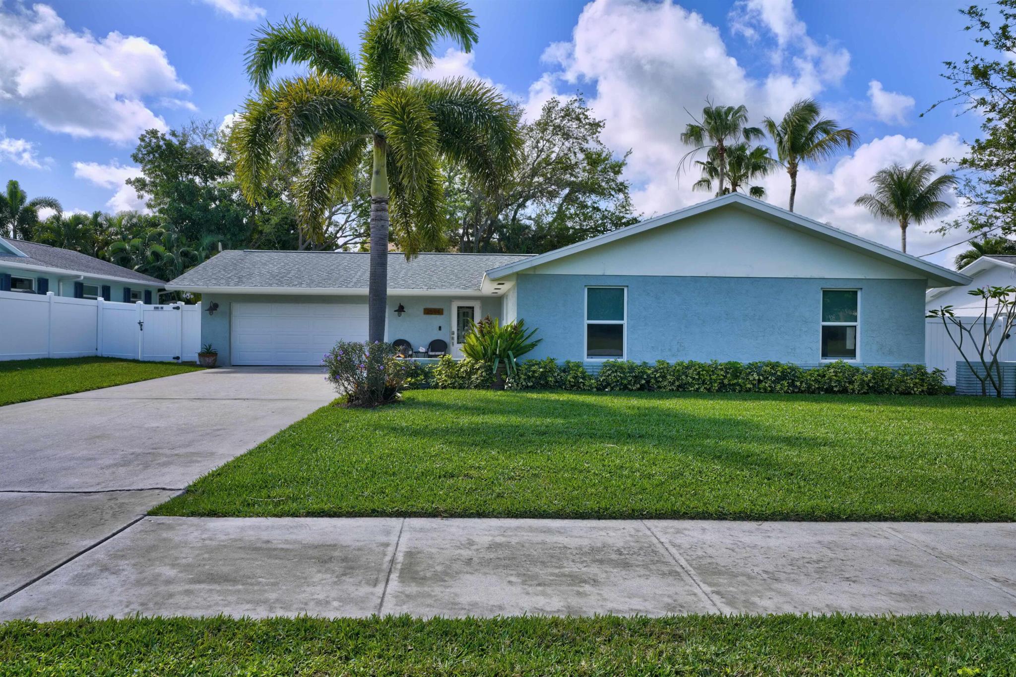 Experience the epitome of coastal living in our stunning 3BR/2BA single-story haven, nestled just a stone's throw away from the shimmering blue Atlantic Ocean. This fully furnished gem boasts a convenient open floor plan and a private garage, ensuring a blend of luxury and comfort. The home opens up to a fully fenced tropical backyard, complete with a cozy fire pit, enchanting outdoor lighting, and comfortable patio seating, creating the perfect oasis for relaxation or entertaining.Strategically located within walking distance, this property offers easy access to a dog-friendly beach, the iconic Juno Beach Pier, the serene Bluffs Marina, as well as a variety of stores and restaurants, ensuring everything you need is right at your doorstep.