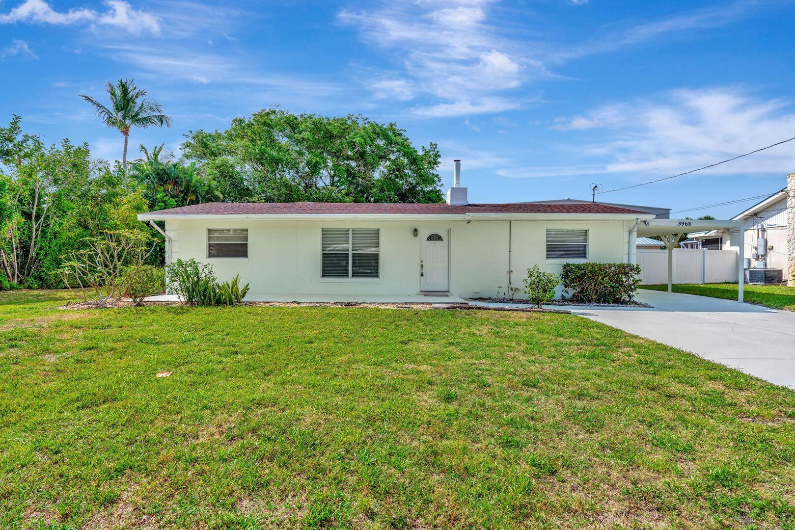 Beachside Bliss in Hobe Sound - Move-In Ready with Room to Roam! Coastal charm meets everyday convenience in this beautifully updated 3-bedroom, 2-bathroom single-family home, nestled in a sought-after Hobe Sound neighborhood. Just a short stroll to the beach, this move-in ready oasis features an expansive yard, perfect for entertaining or relaxing under the Florida sun. The living room features a working fireplace with high ceilings, kitchen has a built-in kitchen table with cabinets in the base. Also has a laundry room and plumbing for laundry sink. Flooring is ceramic tile and architectural. Shingle roof is four years old. Electric wiring was updated, including a new breaker panel. All water supply lines were replaced along with the central air conditioning in 2024. Attached single car